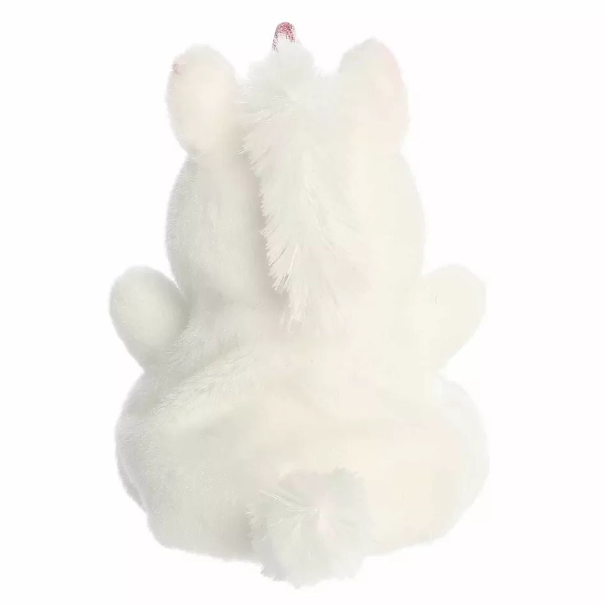 The rear view of the white Aurora unicorn stuffed animal displaying its plush mane and compact rounded shape.
