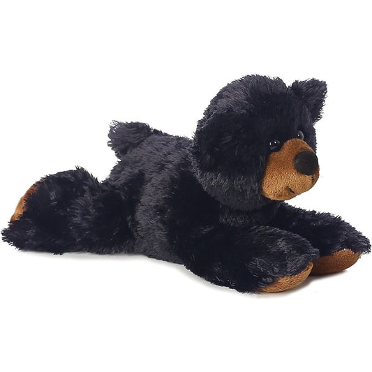 Angled front view of the Aurora Mini Flopsie Sullivan the Black Bear 8-inch plush resting on its belly, featuring black fur and a brown muzzle.