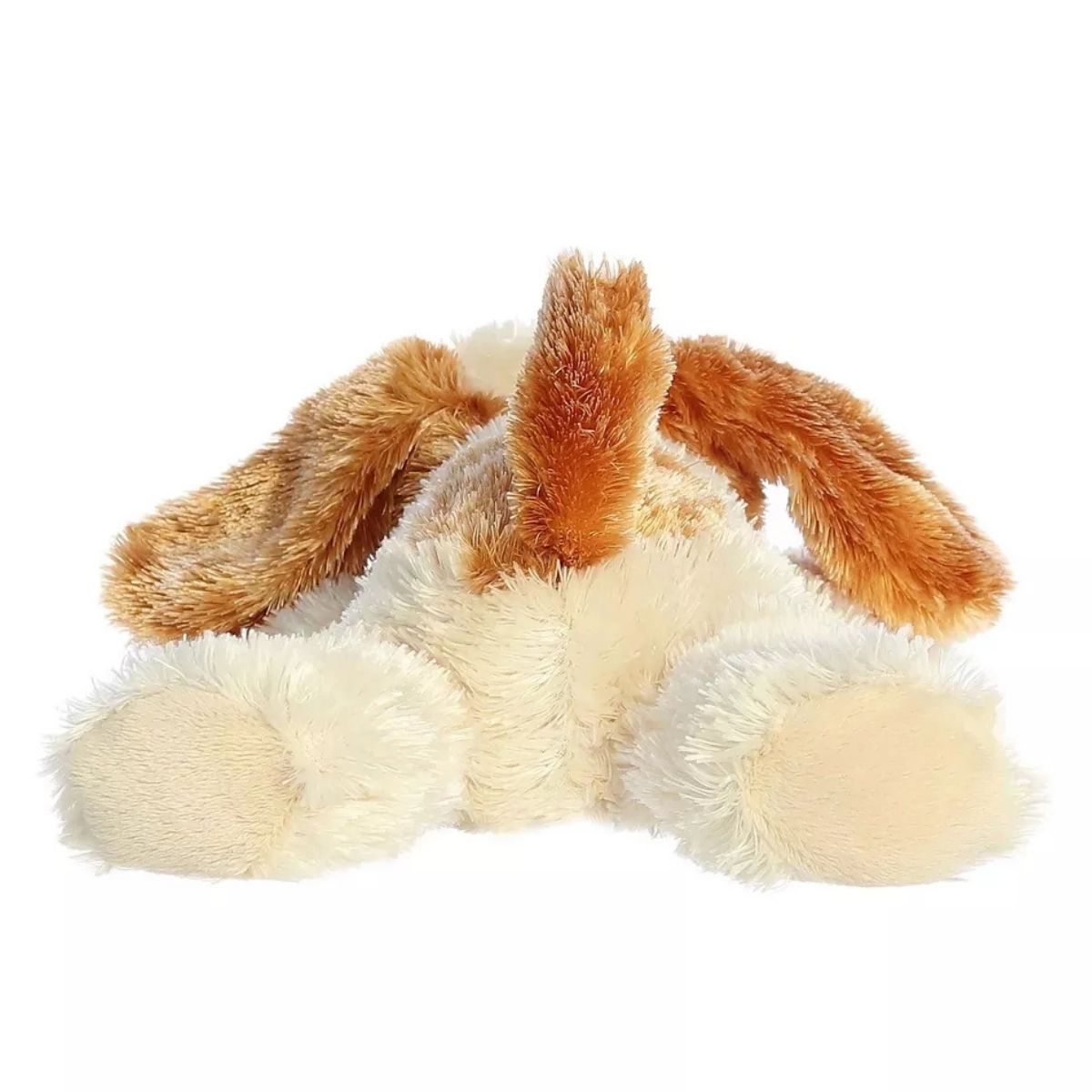 Rear view of the puppy plush showing its hind legs stretched out flat and its cute upright brown tail.