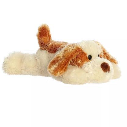 Angled side view of the Aurora Mini Flopsie Scruff Puppy 8-inch plush resting on its belly, featuring brown and cream patched fur and floppy ears.