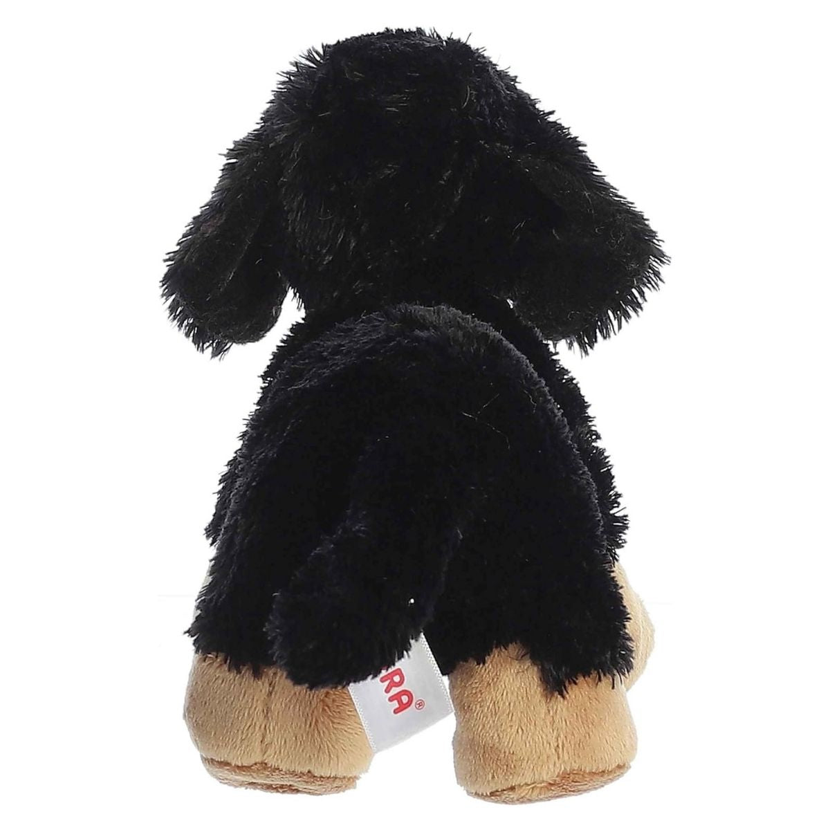 Direct back view of the cuddly dachshund plush highlighting its black tail and floppy ears.