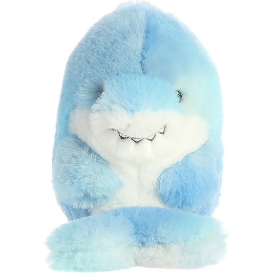 Straight-on front view of the soft light blue Rolly Pet shark plush sitting upright, showing its white belly and embroidered toothy smile.