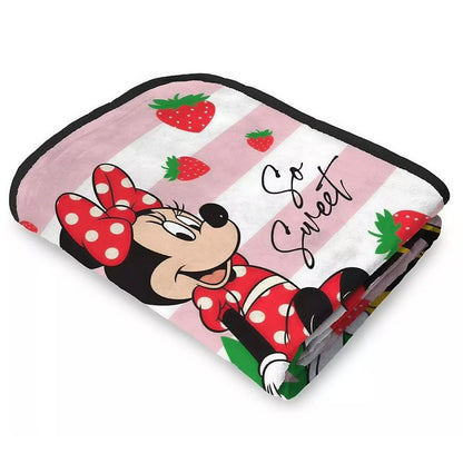 Angled view of the Minnie Mouse strawberry throw blanket neatly folded to show the soft fabric texture.