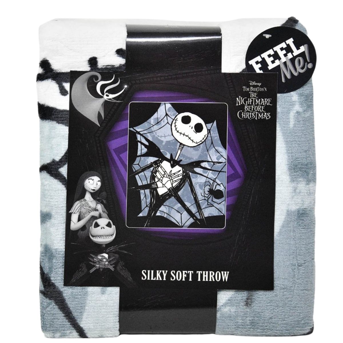 The Jack Skellington throw blanket neatly folded and packaged with a branded black cardboard wrap.