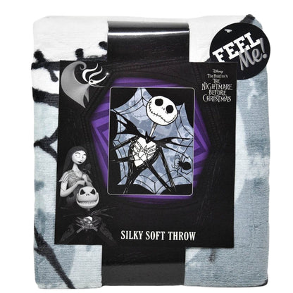 The Jack Skellington throw blanket neatly folded and packaged with a branded black cardboard wrap.