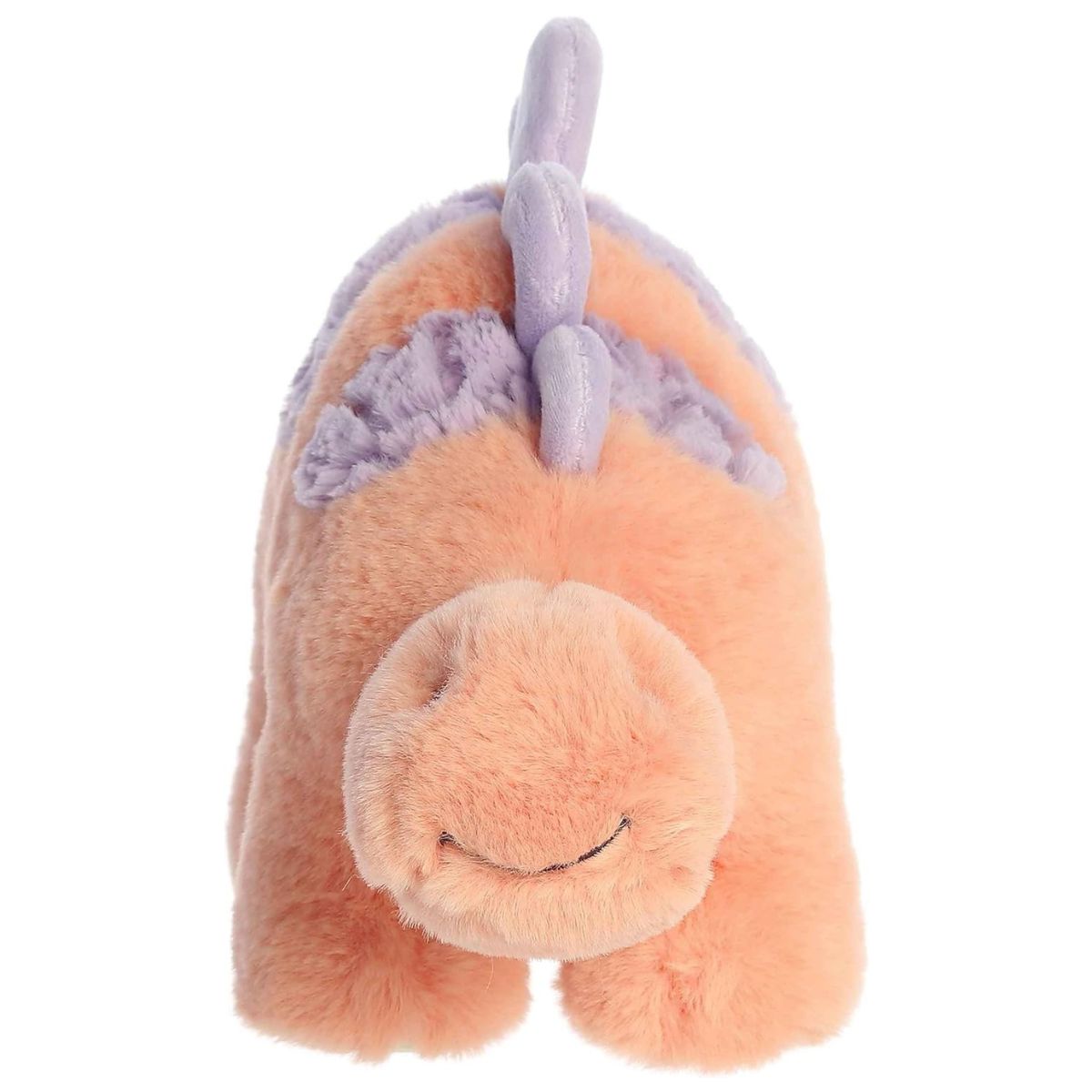 Straight front view of the peach Stegosaurus plush standing on four legs, showing her friendly embroidered smile.