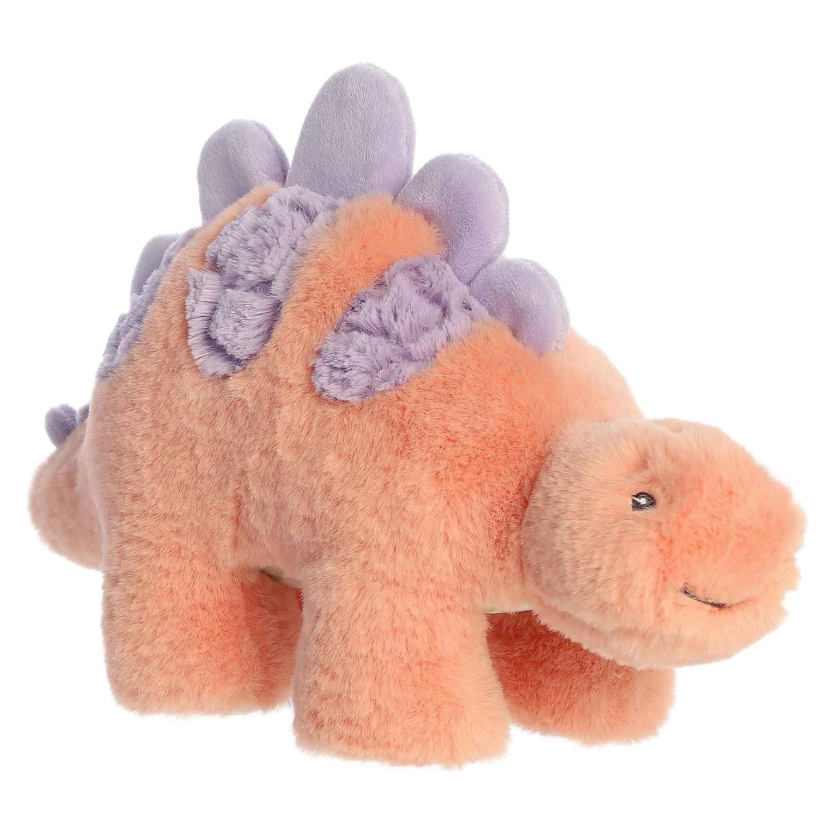 Angled side view of the 12-inch Aurora Softiesaurus Sammi Stegosaurus plush featuring shaggy peach fur and lavender purple plates.