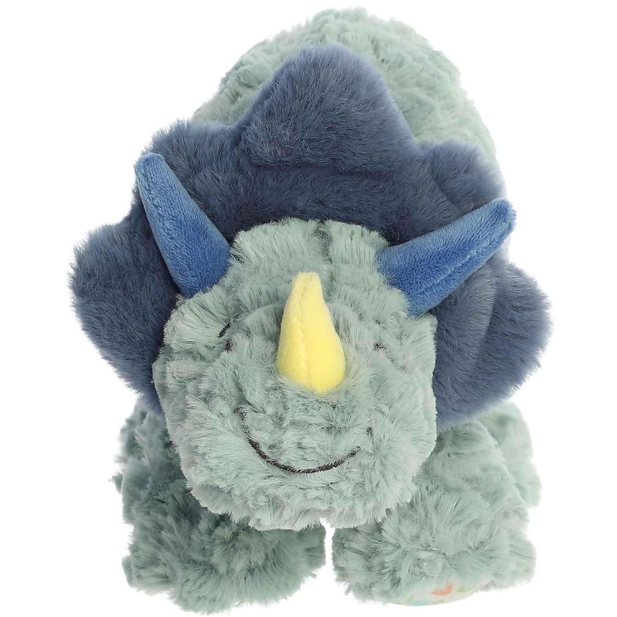 Straight front view of the green Triceratops plush standing on four legs, showing her friendly embroidered smile and soft horns.