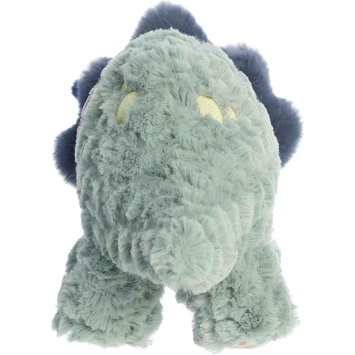 Back angled view of the Traci Triceratops stuffed animal highlighting her textured green back, tail, and soft yellow spots.