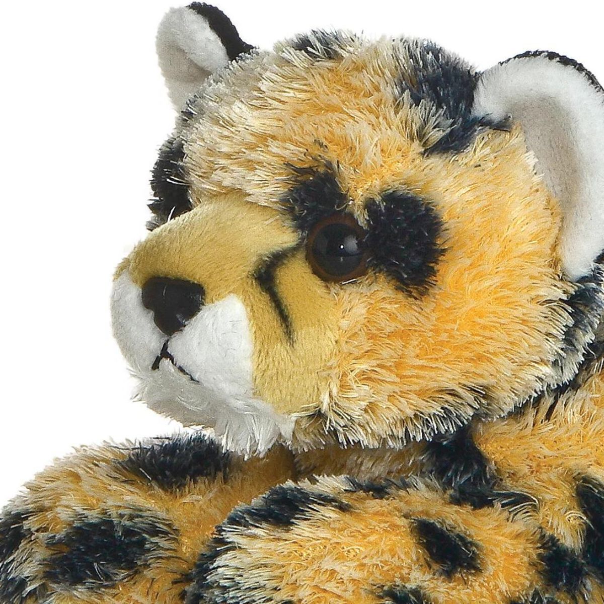 Close-up view of the cheetah's face highlighting its signature black tear marks, white muzzle, and sweet dark eyes.