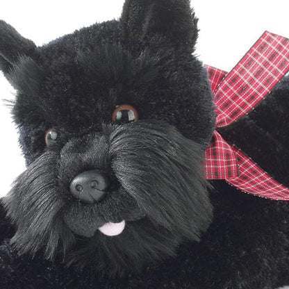 Close-up view of the Scottish Terrier stuffed animal highlighting its signature black beard, dark eyes, and cute pink tongue.