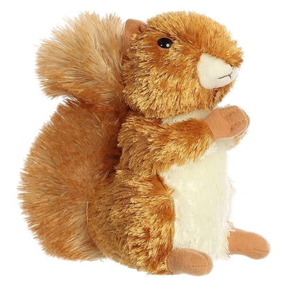 Angled side view of the Aurora Mini Flopsie Nutsie the Red Squirrel 8-inch plush sitting upright, featuring bright auburn fur and a bushy tail.