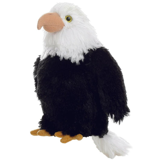 Side view of the Aurora Mini Flopsie Liberty the Bald Eagle 8-inch plush sitting upright, featuring a black body, white head, and yellow beak.