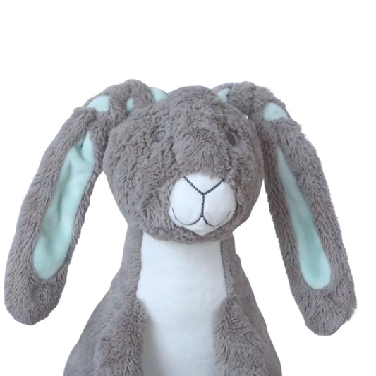 Close-up shot of the head and floppy ears of the Happy Horse Rabbit Twine plush toy, showing the mint green interior lining.