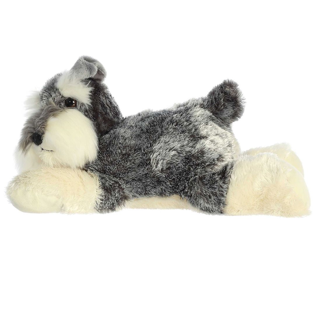 Side profile view of the grey Schnauzer plush showing its lounging posture, perky ears, and short upright tail.