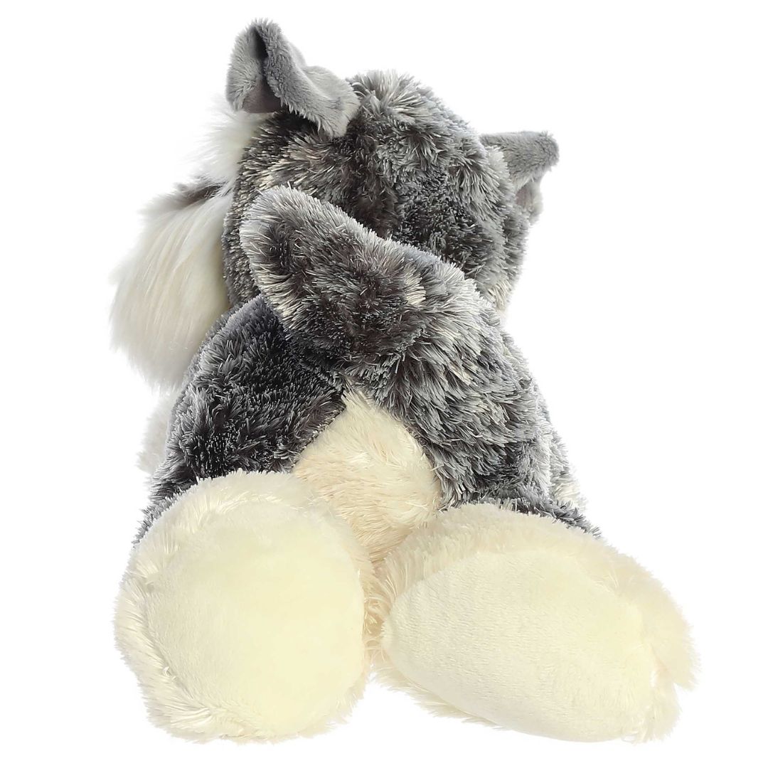 Rear view of the Ludwig Schnauzer plush showing its textured grey back, upright tail, and large cream-colored back paws.