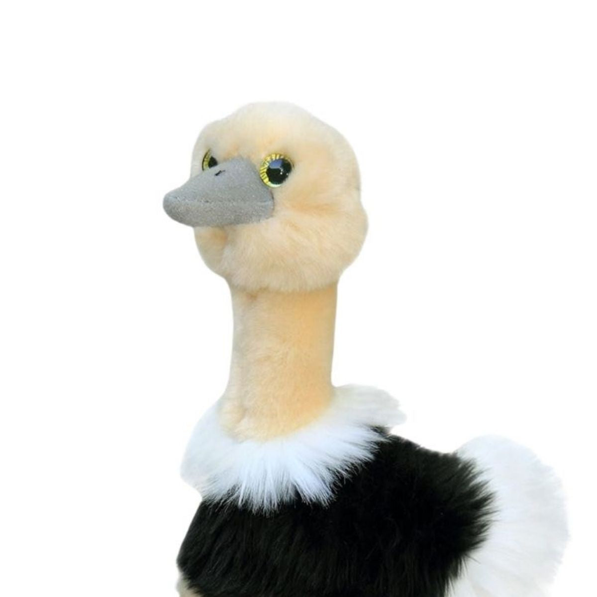 Close-up front profile of the ostrich stuffed animal highlighting its smooth tan neck, golden eyes, and soft grey beak.