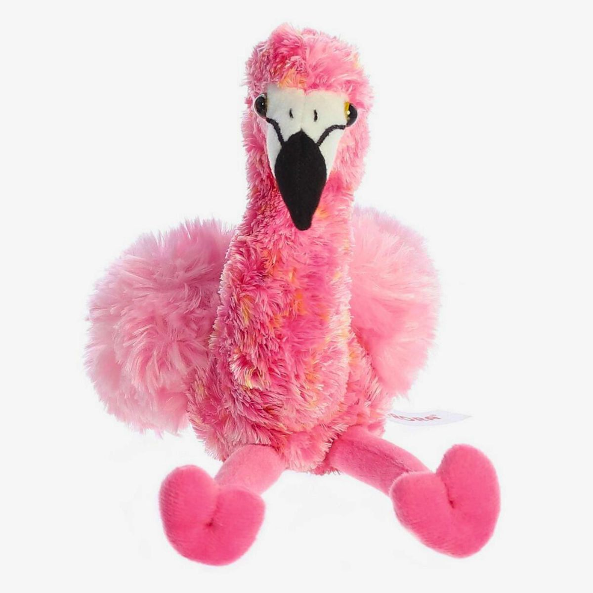 Direct front view of the soft pink Mini Flopsie flamingo stuffed animal sitting down with its legs splayed forward.