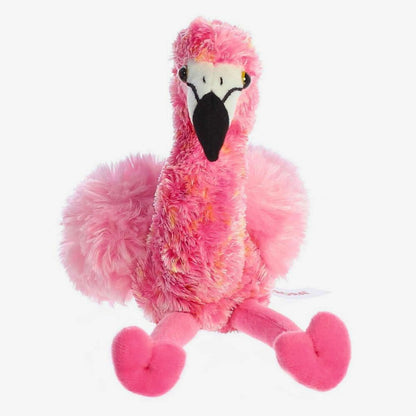 Direct front view of the soft pink Mini Flopsie flamingo stuffed animal sitting down with its legs splayed forward.