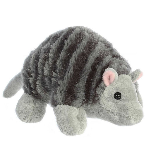 Angled side view of the Aurora Mini Flopsie Armadillo 8-inch plush featuring textured grey "shell" fur and pink-lined ears.