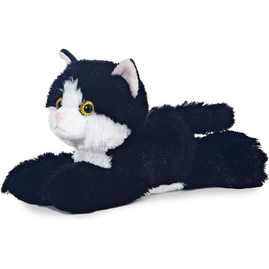 Angled side view of the Aurora Mini Flopsie Maynard Kitten 8-inch plush resting on its belly, featuring black and white tuxedo fur.