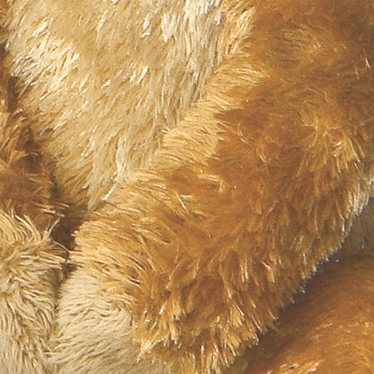 Close-up view highlighting the ultra-soft golden-brown plush fur and folded paws of the Mini Flopsie Meerkat toy.