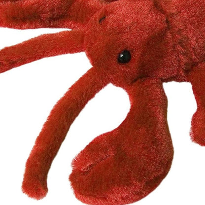 Close-up view of the adorable Aurora Lobster stuffed animal featuring its sweet dark eyes, antennae, and plush claws.
