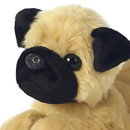 Close-up view of the Pug stuffed animal's face highlighting its signature black muzzle, floppy ears, and sweet dark eyes.