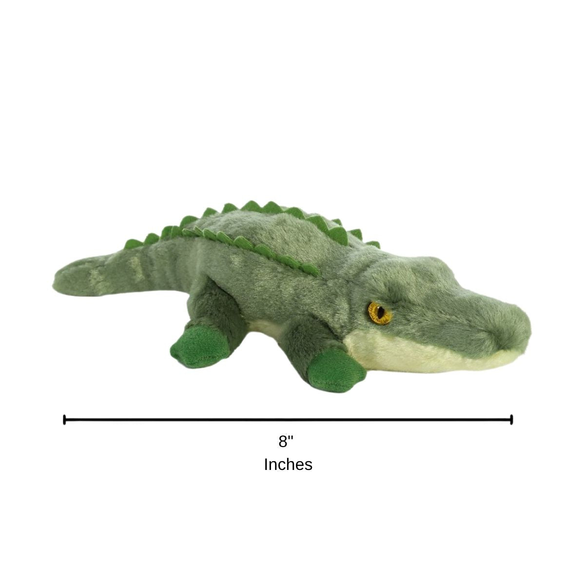 Side profile sizing graphic for the Aurora Mini Flopsie Swampy the Crocodile plush resting on its belly, indicating a total length of 8 inches.