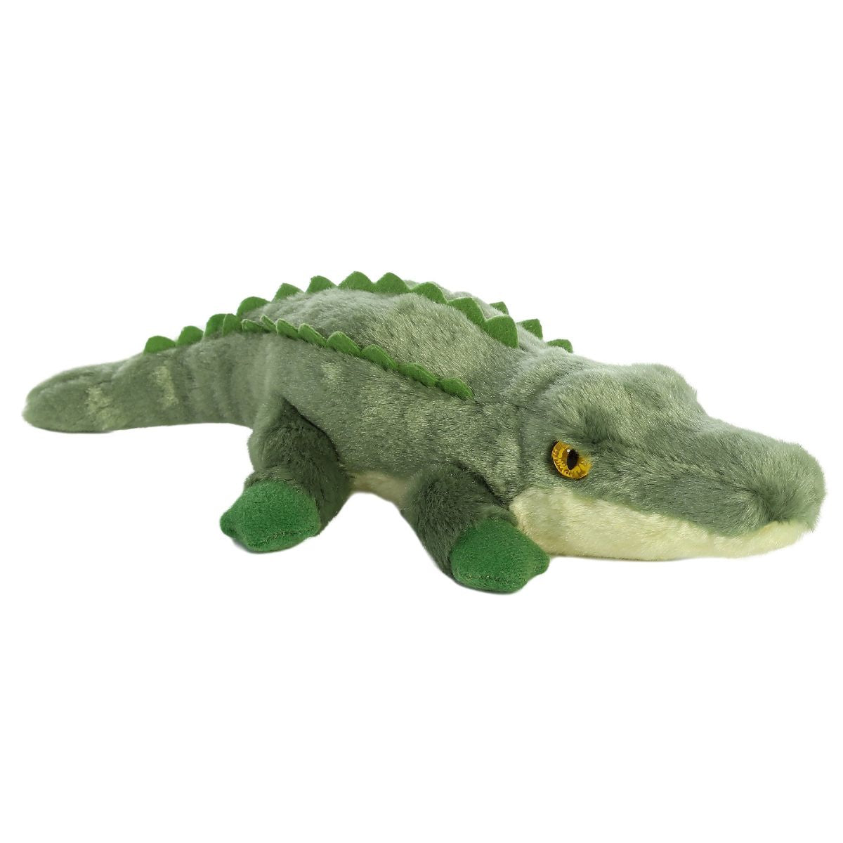 Angled view of the Aurora Mini Flopsie 8-inch Swampy the Crocodile plush resting on its belly, showing its green body and soft back ridges.