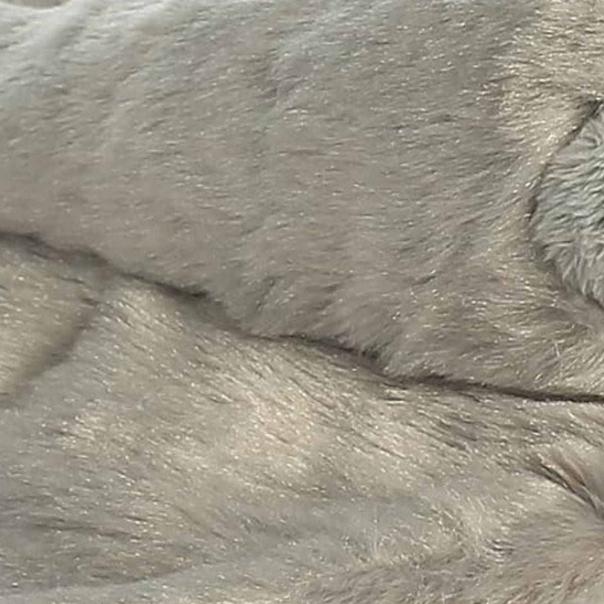 Detailed close-up of the plush fabric showing the soft, multi-tonal grey fur fibers of the stingray.