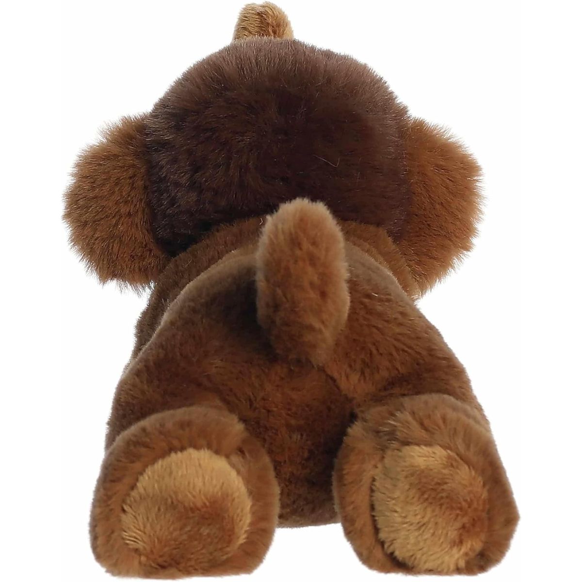Back view of the resting woolly mammoth stuffed animal showing its soft brown plush body, rear legs, and small tail.