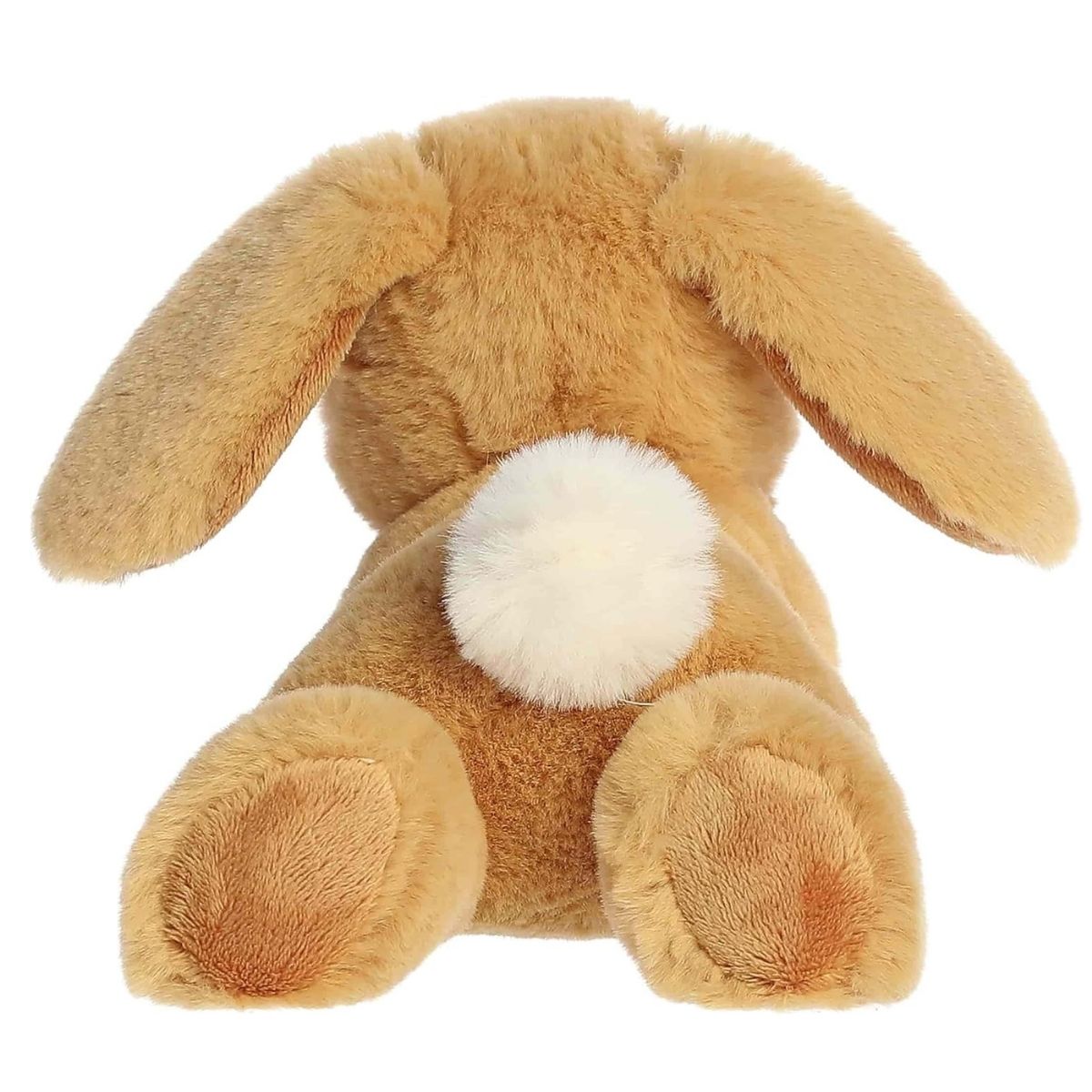 Back view of the Aurora Flopsie bunny plush toy showing its soft tan back, floppy ears resting down, and a bright white cotton tail.