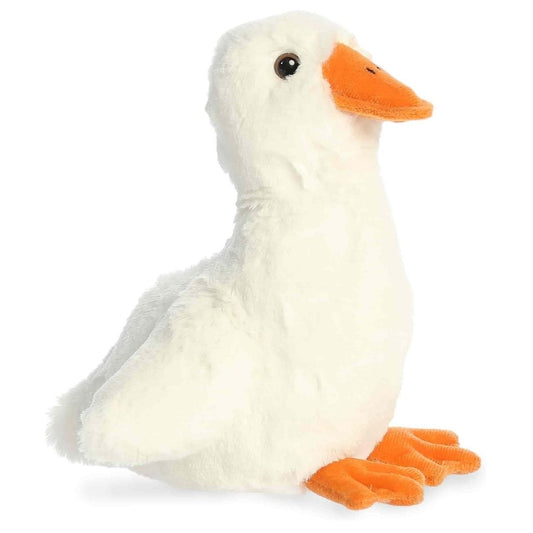 Angled side view of the Aurora Flopsie 8-inch Waddles Goose plush resting, showing its soft white feathers, orange beak, and orange webbed feet.