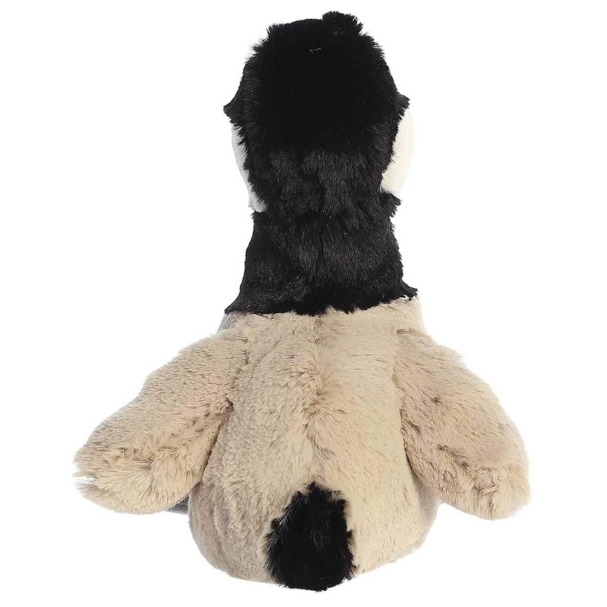 Back view of the Aurora Flopsie goose plush toy showing its tan back, black neck, and small black tail feathers.