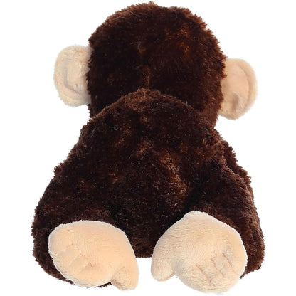 Rear view of the chimpanzee plush showing its dark brown back and light tan feet resting on the ground.
