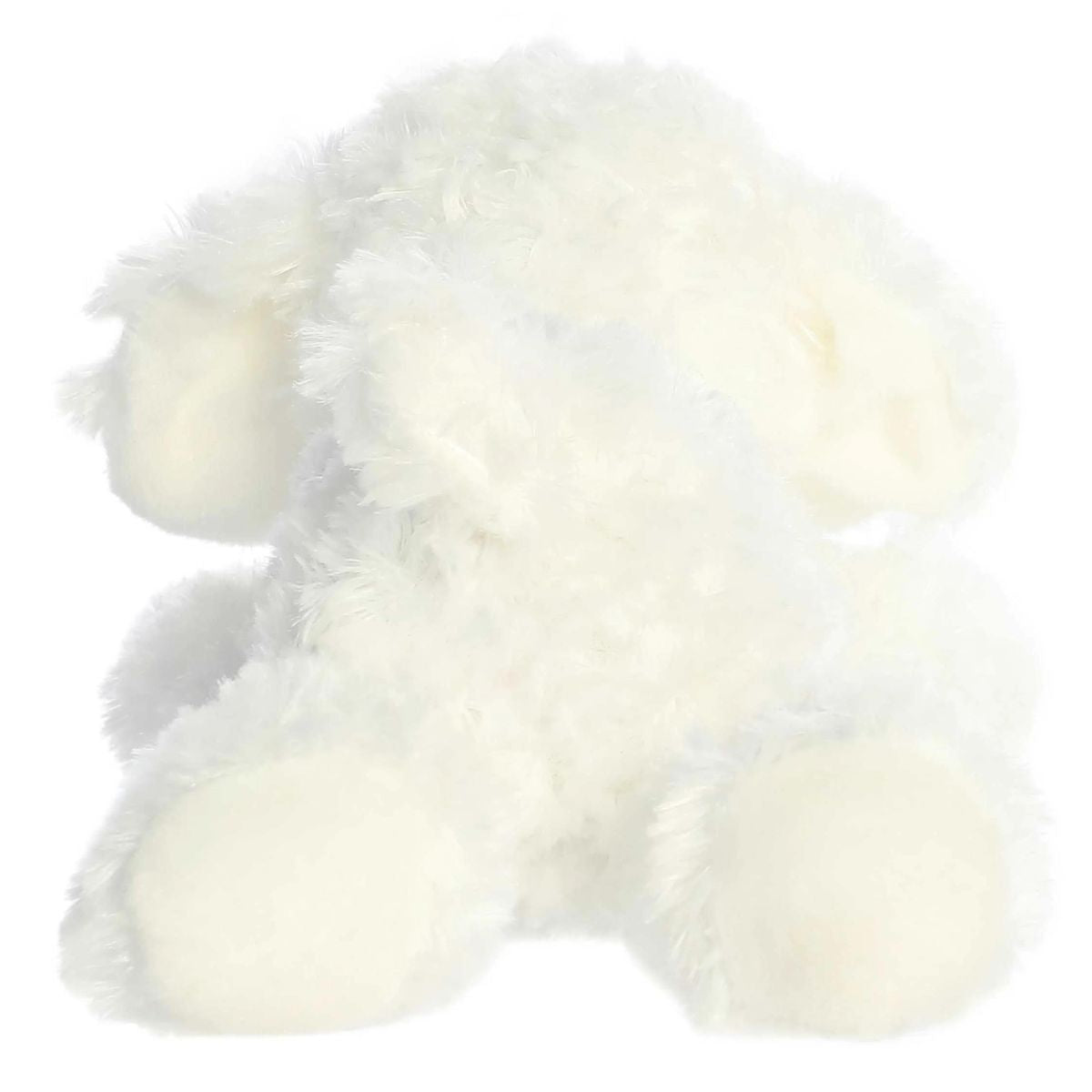 Direct back view of the dog plush highlighting her small white tail and the bottoms of her hind paws.