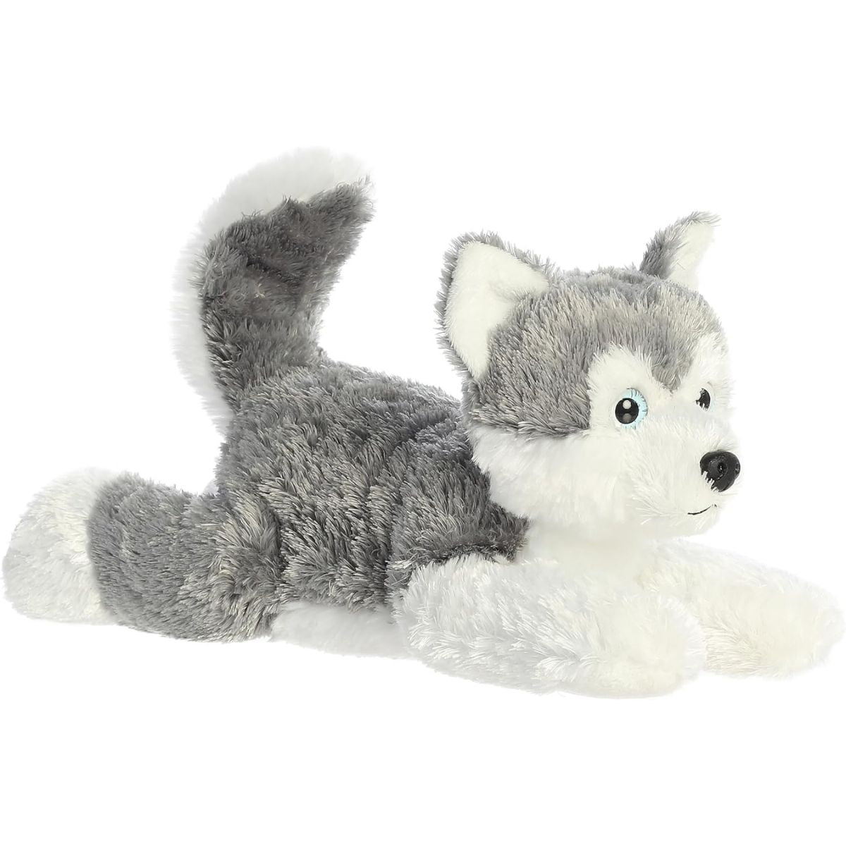 Angled front view of the 12-inch Aurora Flopsie Shadow Siberian Husky stuffed animal lying down, showing his grey and white fur and perky tail.