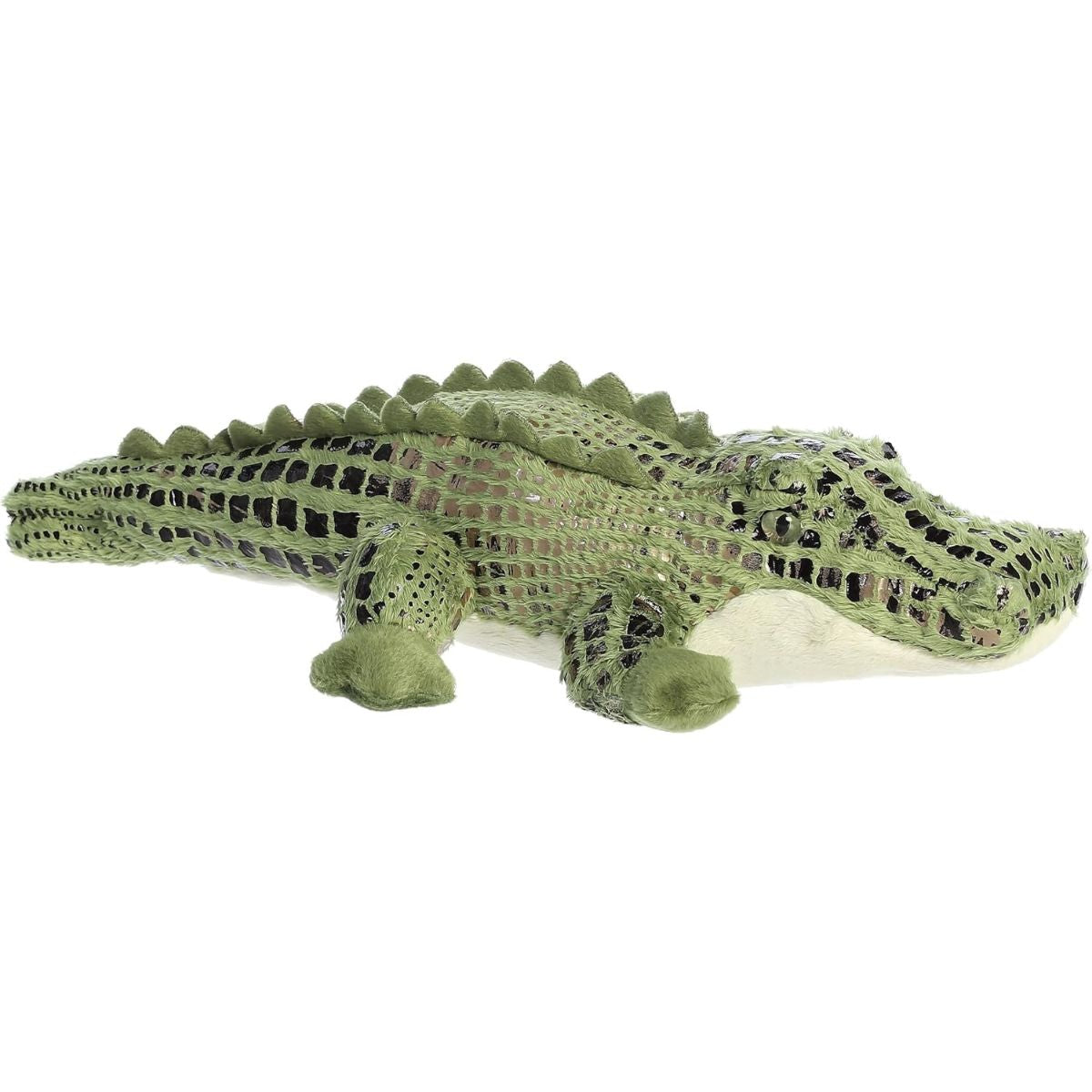Angled side view of the Aurora Flopsie Alli Alligator 14-inch plush resting on its belly, featuring patterned green fur and soft ridges along its back.