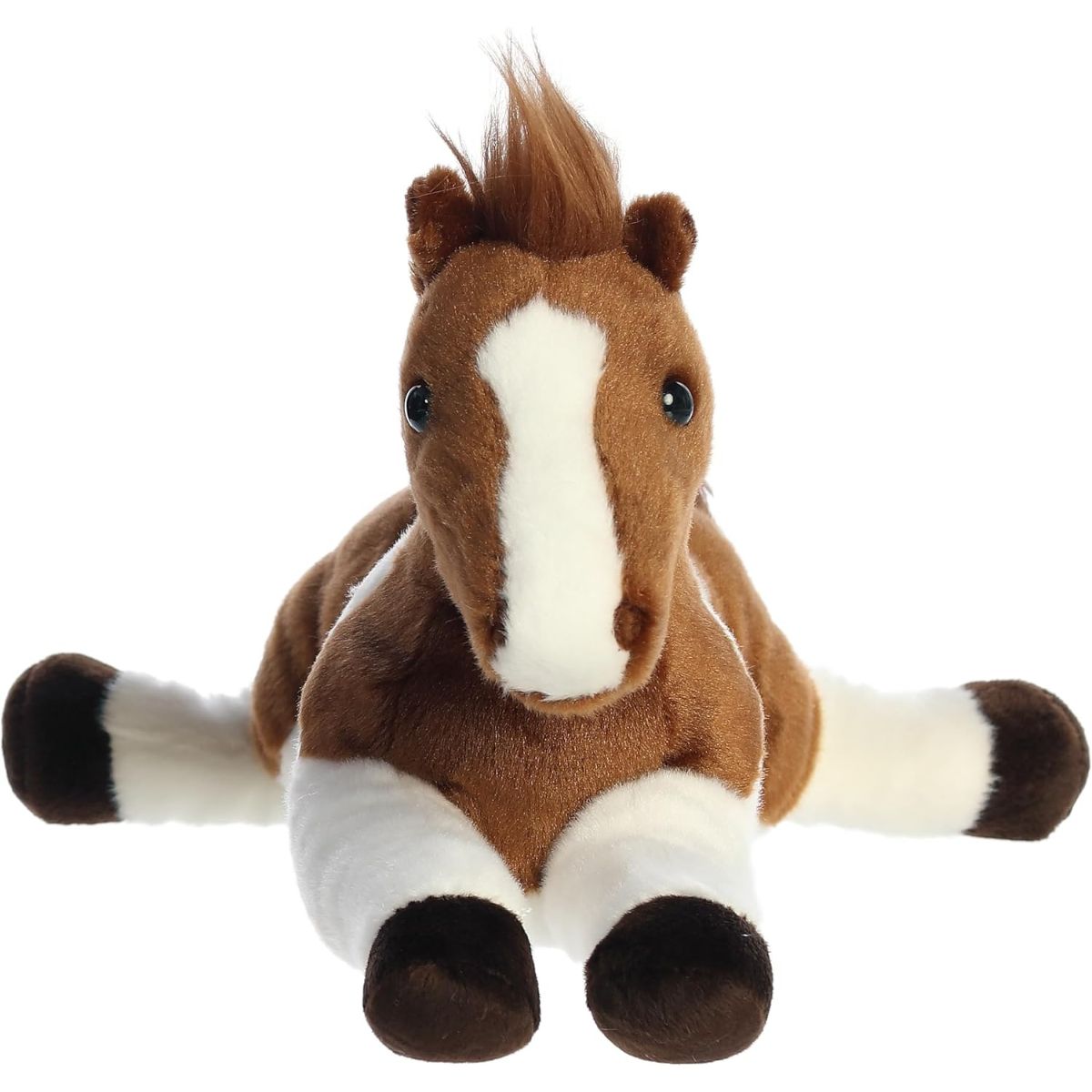 Straight-on front view of the soft pinto horse plush showing its sweet face, white blaze, and front legs stretched out.