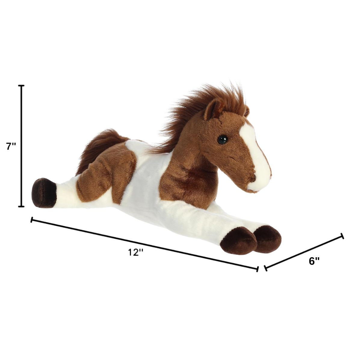 Angled side profile of the Tola Pinto Horse plush resting on its tummy with measurement graphics indicating it is 12 inches long, 7 inches tall, and 6 inches wide.