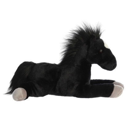 Side profile view of the black stallion plush showing its lounging posture, light grey hooves, and flowing black mane.