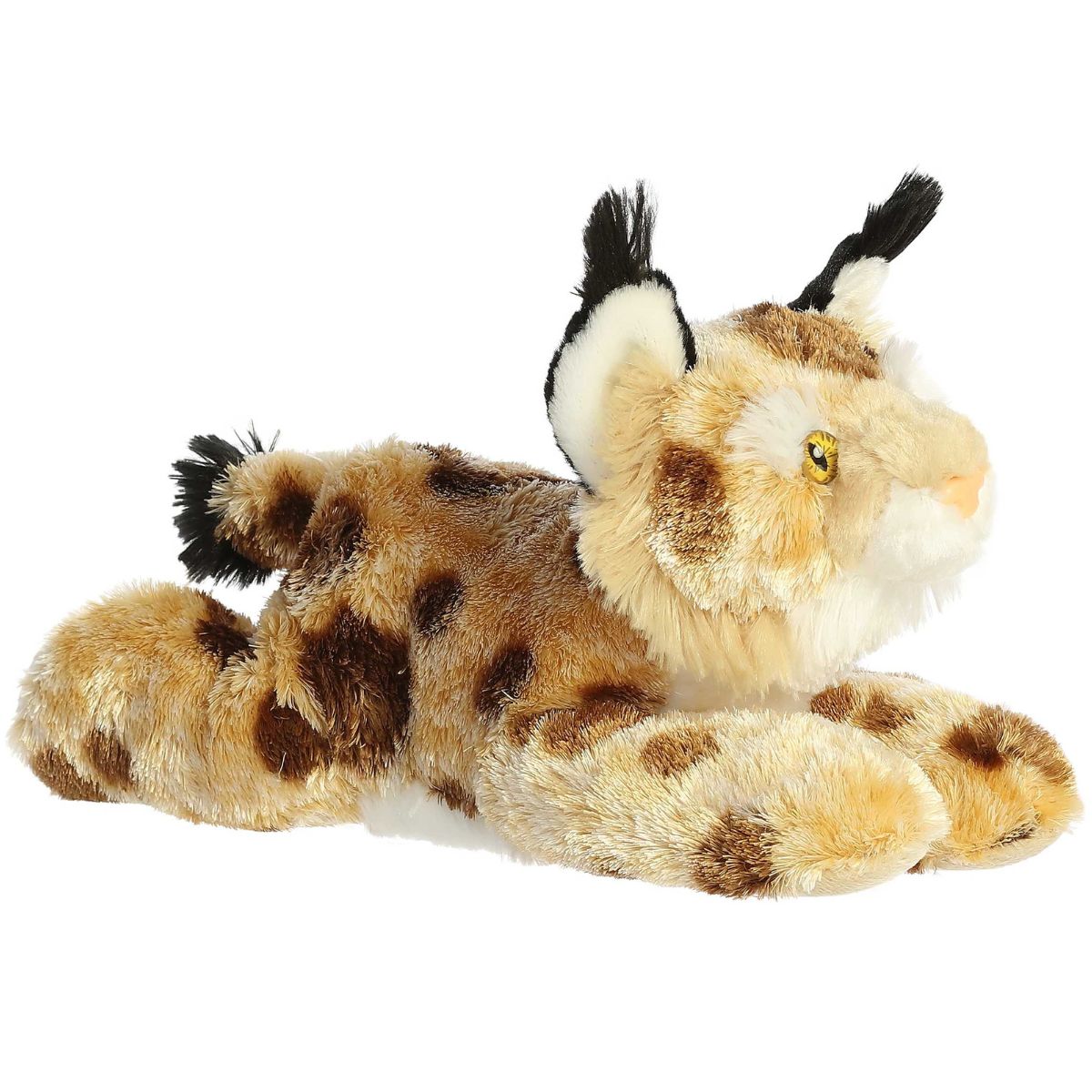 Angled front view of the Aurora Flopsie Bobby the Bobcat 12-inch plush resting on its belly, featuring tan fur with dark spots and black ear tufts.