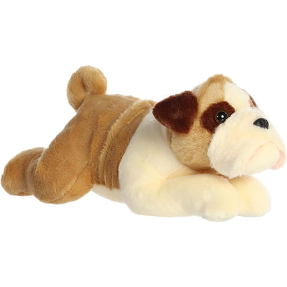 Angled front view of the Aurora Flopsie Willis the English Bulldog 12-inch plush resting on its belly, featuring tan and white fur.