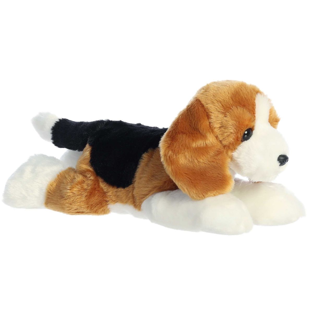Side profile view of the tri-color Beagle plush showing its lounging posture and black saddle marking.