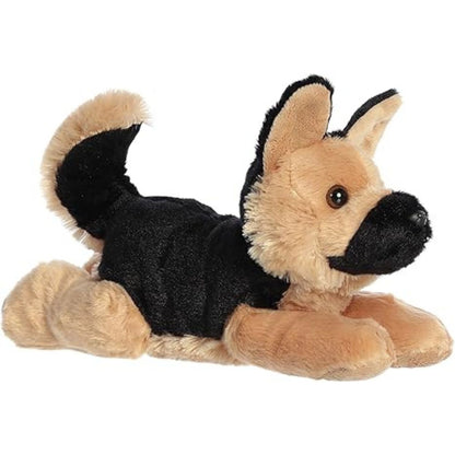Angled side view of the Aurora Flopsie Bismarck the German Shepherd 12-inch plush resting on its belly, featuring a tan and black coat.
