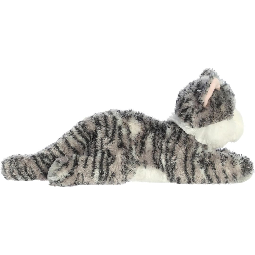 Side profile view of the cuddly Lily cat stuffed animal resting comfortably on her tummy.