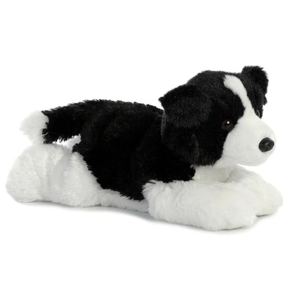 Angled front view of the 12-inch Aurora Flopsie Border Collie stuffed animal lying down, showing its black and white fur.