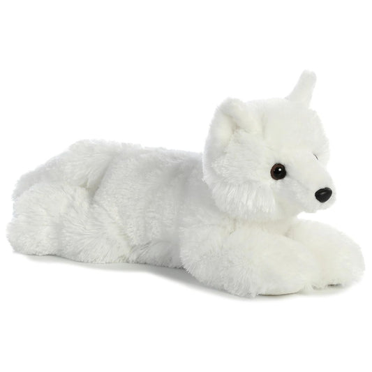 Angled front view of the Aurora Flopsie Arctic White Fox 12-inch plush resting on its belly, featuring fluffy white fur and a black nose.