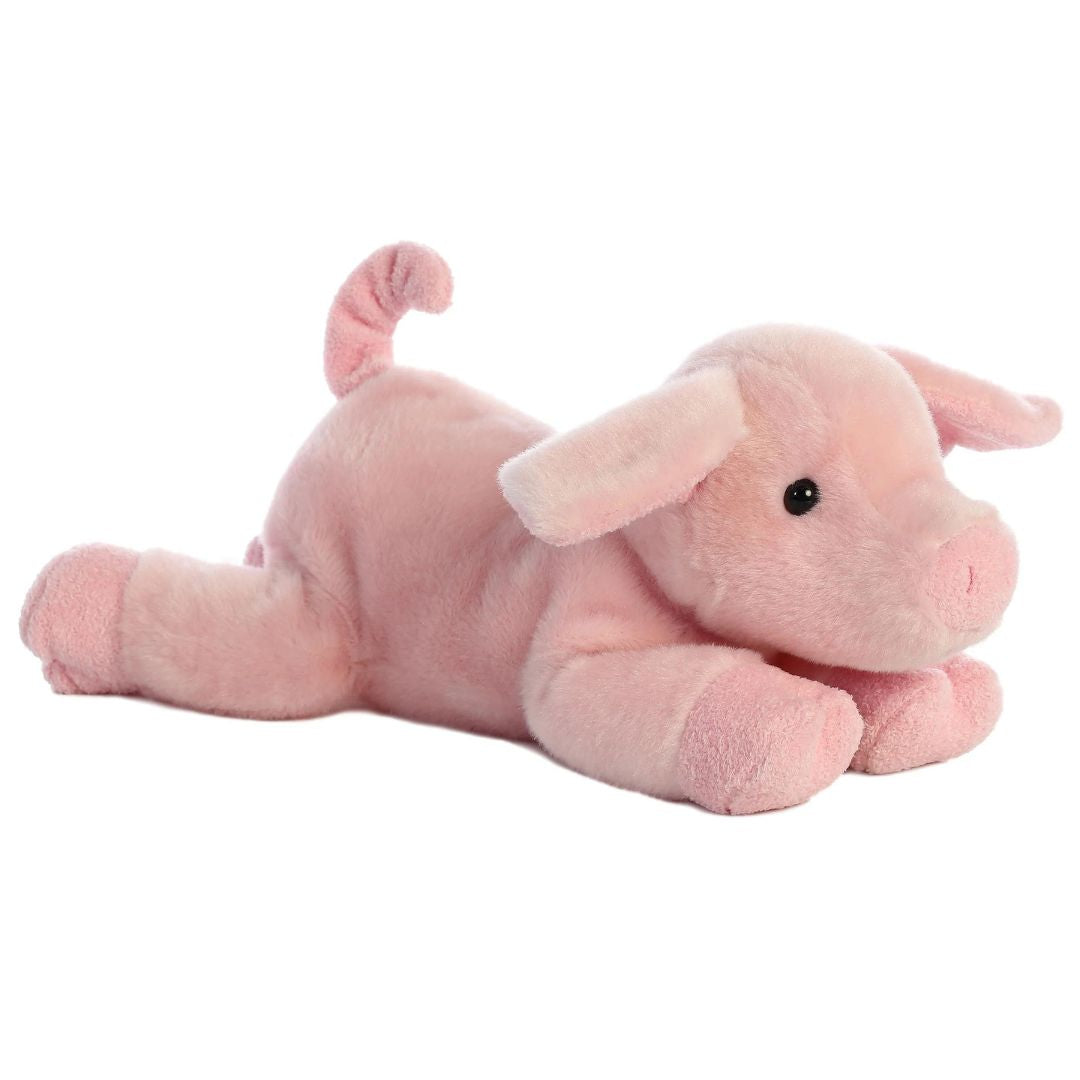 Angled front view of the pink piglet stuffed animal highlighting its sweet face, plush snout, and lounging posture.